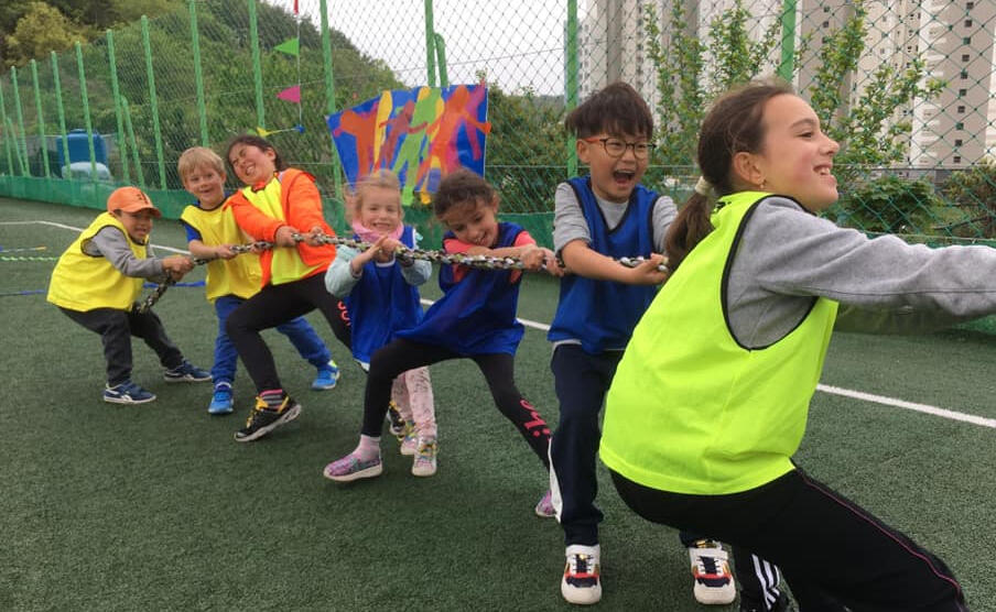 Team-building activities at BIA Students engaging in outdoor teamwork at BIA Geoje